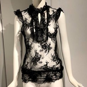 Sexy shear black top!  Size L fits like M